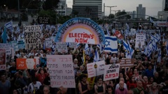 People attend a protest against Israeli Prime Minister Benjamin Netanyahu's government and demanding elections, in Tel Aviv, Israel. Photo / AP