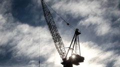 Construction cranes rise above Auckland city's skyline. Photo / Michael Craig
