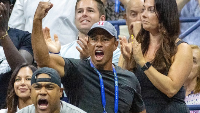 Tiger Woods cheers Serena Williams on from the crowd at Arthur Ashe Stadium. Photo / Getty