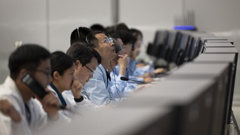 In this photo released by Xinhua News Agency, technical personnel work at the Beijing Aerospace Control Center (BACC) in Beijing, Sunday, June 2, 2024. A Chinese spacecraft landed on the far side of the moon Sunday to collect soil and rock samples that could provide insights into differences between the less-explored region and the better-known near side. (Jin Liwang/Xinhua via AP)