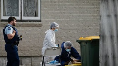 Police and forensic teams carry out a scene examination at a property in Massey, West Auckland. Photo / Alex Burton