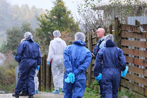 Police and forensic team comb a Te Kūiti property connected to the homicide investigation. Photo / Maryana Garcia