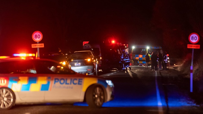 Emergency services at the scene of the fatal crash on Malaghans Rd, Dalefield, on Thursday night. 