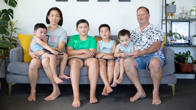 Sharon Choo, Barry Eade, and their children (L-R) Riccardo, Sebastian, Alexander and Nicolas. While Barry and the children are all NZ citizens, Immigration NZ has declined the mother of four residency because her husband has previously sponsored others from overseas. 9th February 2022, New Zealand Herald photograph by Sylvie Whinray