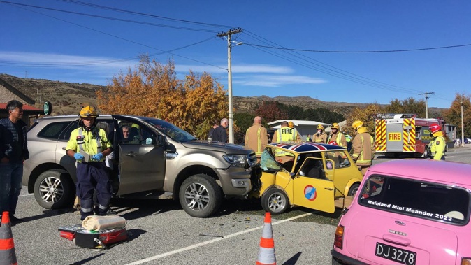 Emergency services attend a serious collision between a Morris Mini and a Ford Everest in the main street of Oturehua yesterday. (Photo / Jared Morgan)