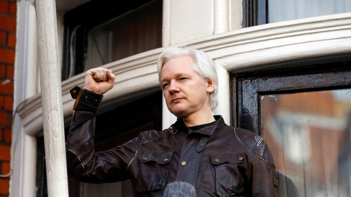 Julian Assange greets supporters outside the Ecuadorian embassy in London on May 19, 2017. (Photo / AP)