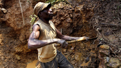 FILE- In this Aug. 17, 2012 file photo, a Congolese miner digs for cassiterite, the major ore of tin, at Nyabibwe mine, in eastern Democratic Republic of Congo. Increased violence and corruption in central Africa could be the result of the recent decision by the U.S. Securities and Exchange Commission not to enforce a rule requiring American companies to report their use of conflict minerals, warn Congolese civic groups, rights groups and U.S. senators. (AP Photo/Marc Hofer, file)