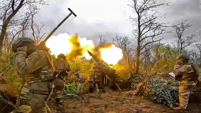 A Russian howitzer fires toward Ukrainian positions at an undisclosed location. Photo / AP