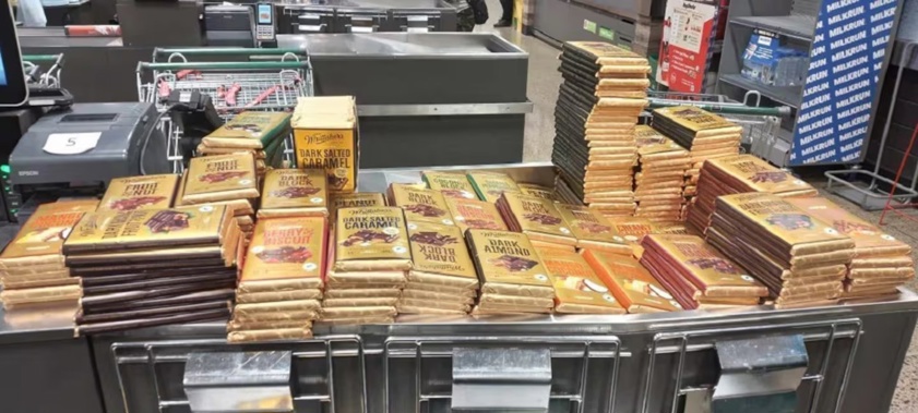 In one incident, the man left a supermarket with 241 blocks of Whittaker’s Chocolate, valued at $1349.60. Photo / NZ Police