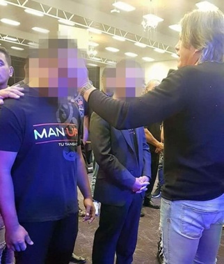Destiny Church leader Brian Tamaki (right) anointing a disciple who is now linked to a police investigation into historic sexual assault allegations at a Counties Manukau youth group. (Photo / NZ Herald)