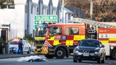 Emergency services rushed to the scene on Riccarton Road in Christchurch on Tuesday afternoon. A bundle of clothes were seen in the middle of the road. Photo / George Heard