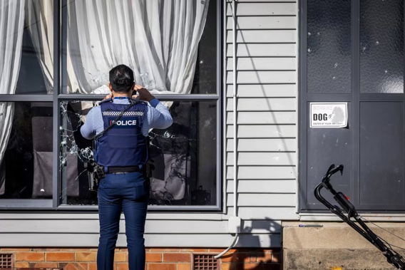 Police investigate the scene of a drive-by shooting on Plumley Cresc in Papatoetoe. Photo / Michael Craig