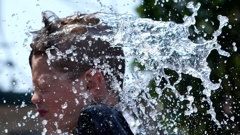 A boy cools off at a fountain during hot weather in Chicago, Sunday, June 16, 2024. Photo / AP