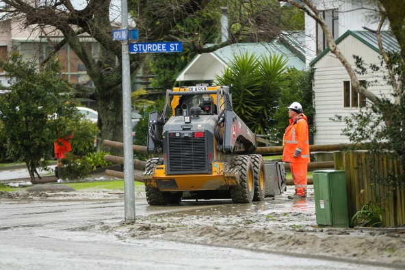 Crews cleaning up flood-hit Wairoa last week. Photo / Paul Taylor 
