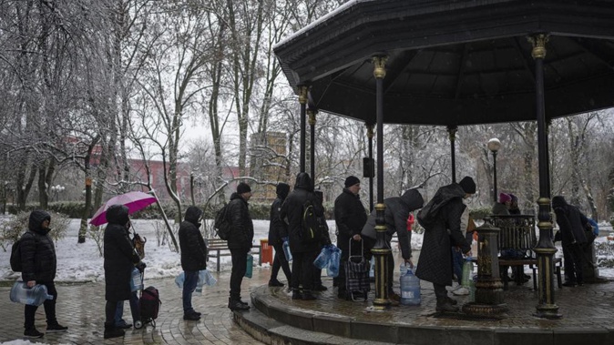 People wait in line to collect water, in Kyiv, Ukraine. Photo / AP