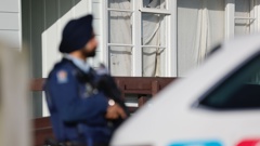 A bullet hole can be seen in a window of the Ōtara house targeted in a shooting overnight. Photo / Michael Craig