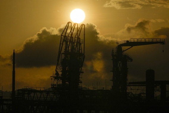 The sun sets over a liquefied natural gas power plant in Santa Clara, Batangas province, Philippines on Tuesday, Aug. 8, 2023. The Philippines is seeing one of the world's biggest buildouts of natural gas infrastructure. (AP Photo/Aaron Favila)